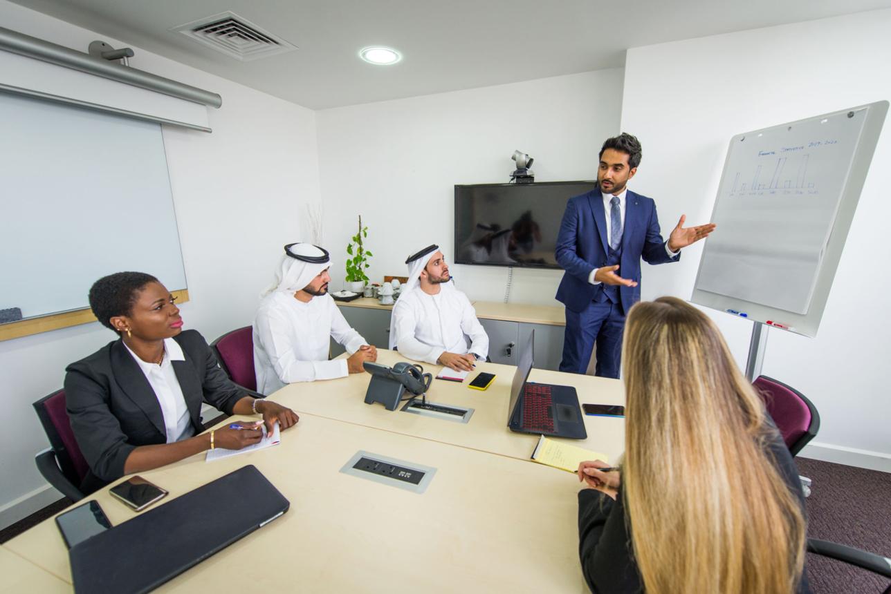 Emporia Trading leadership team reviewing global trade performance in the Dubai office